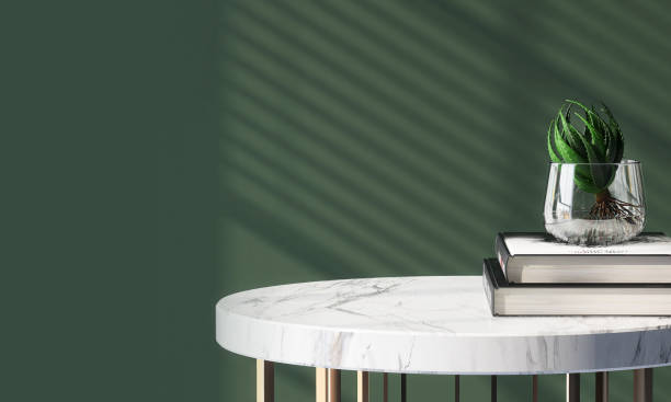 Books on a marble table with flower pot