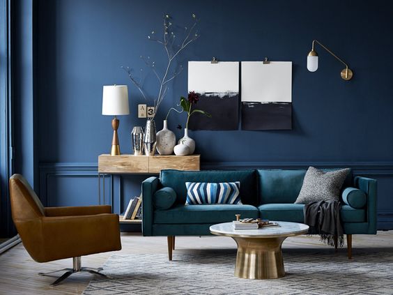 A living room with color through accessories like pillows and artwork
